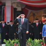 Kemendes dan Kementrans Gelar Upacara Bersama HUT ke-81 RI di Lapangan Parkir